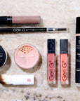 makeup and cosmetics laid out on a table