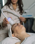 Woman receiving a facial treatment at Geri G.