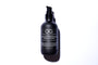 A black pump bottle labeled 'SLEEP & RECOVER DNA REPAIR CREAM 4oz' against a white background.