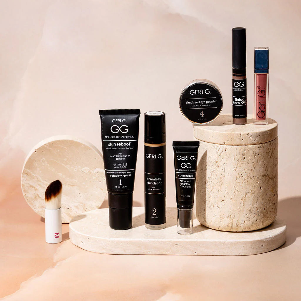 Collection of GERI G skincare and makeup products on a beige surface with a soft background